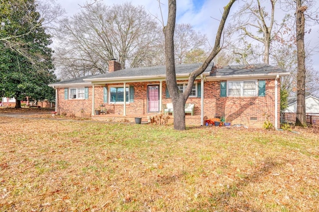 ranch-style home with a front lawn