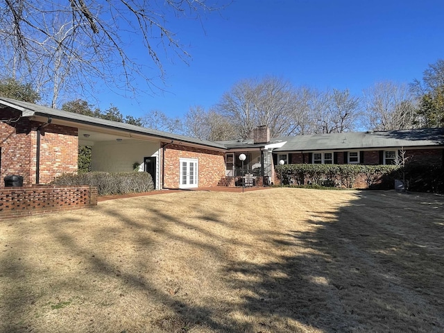 back of property featuring french doors