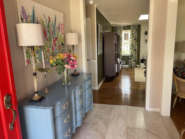 hallway with a textured ceiling