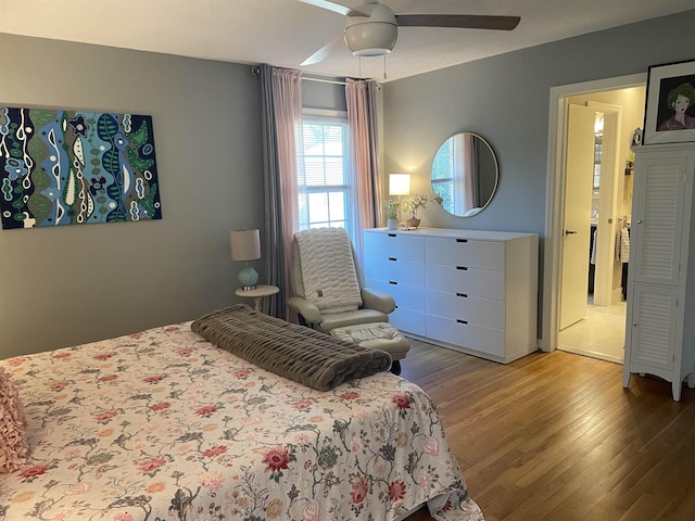 bedroom featuring wood-type flooring and ceiling fan