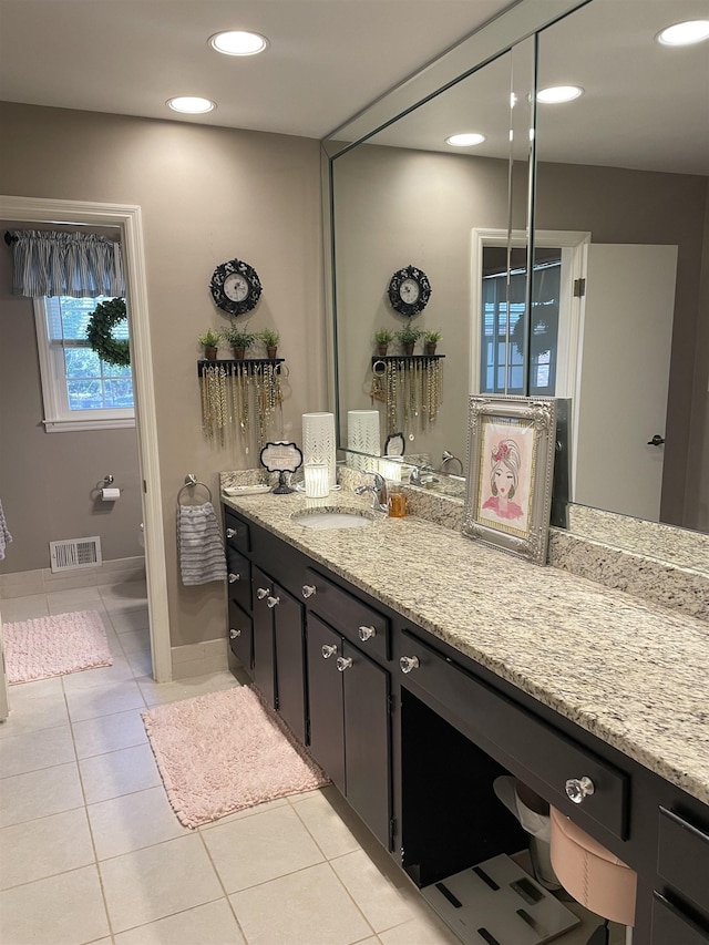 bathroom with tile patterned flooring and vanity