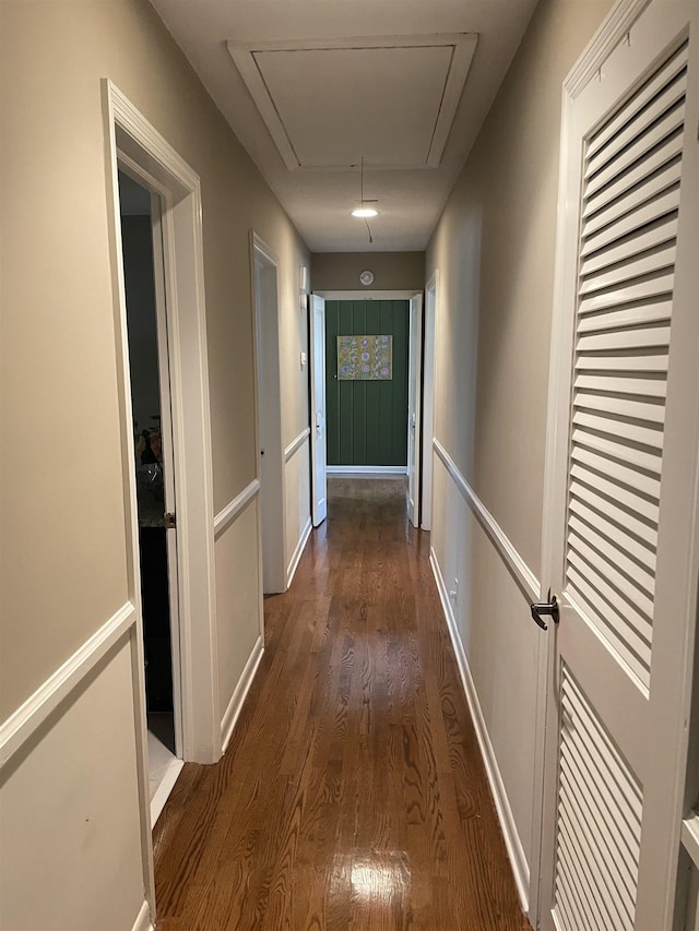 hallway with dark wood-type flooring