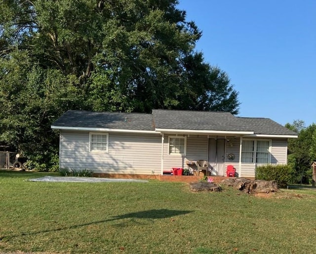 ranch-style home with a front lawn