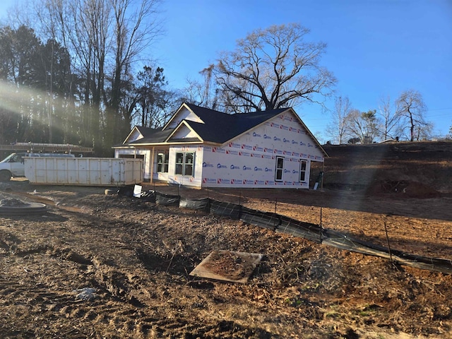 view of side of property with a pool