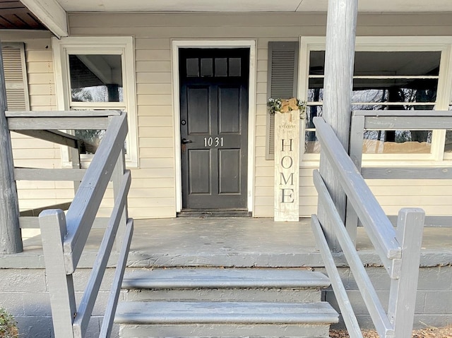 property entrance featuring covered porch