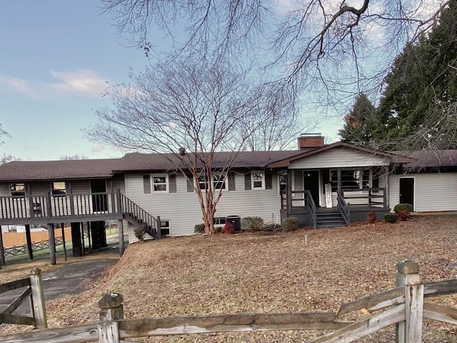 ranch-style house with a deck