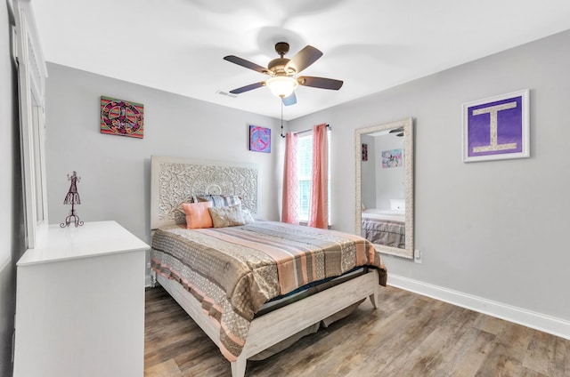 bedroom featuring ceiling fan and hardwood / wood-style flooring