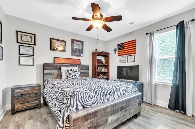 bedroom featuring ceiling fan and light hardwood / wood-style flooring