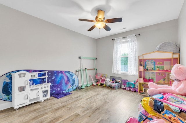 recreation room featuring hardwood / wood-style flooring and ceiling fan