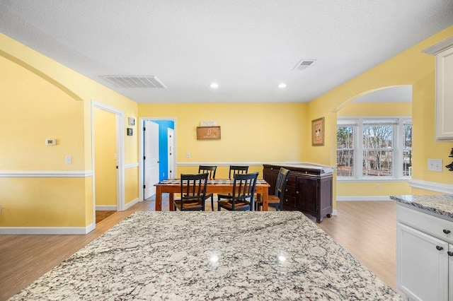 dining area with light wood-type flooring