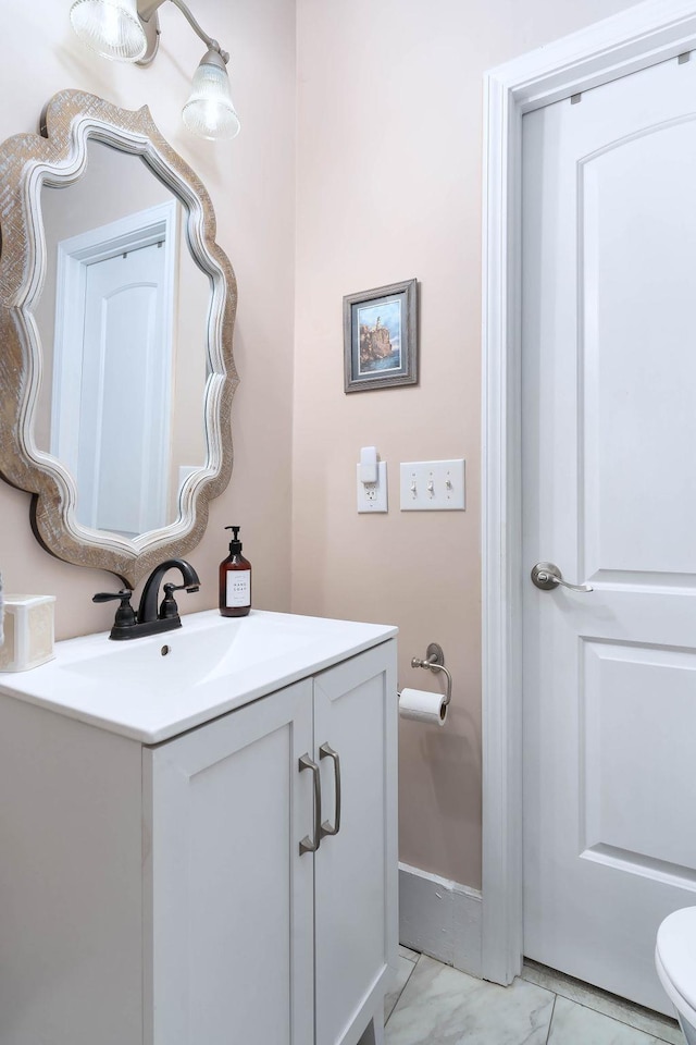 bathroom with vanity and toilet