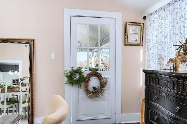 entryway featuring lofted ceiling