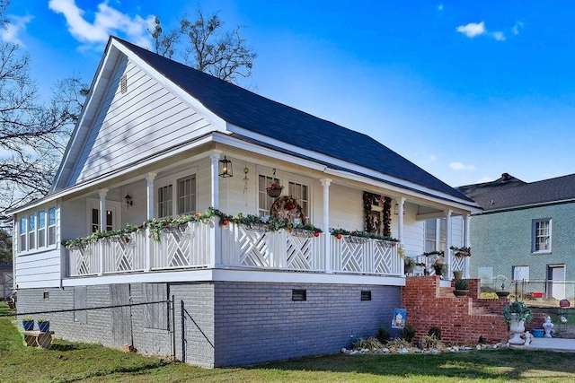 view of home's exterior with covered porch