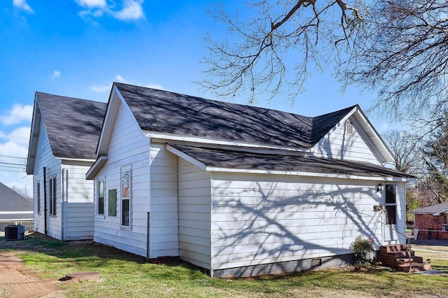 view of property exterior with central AC unit