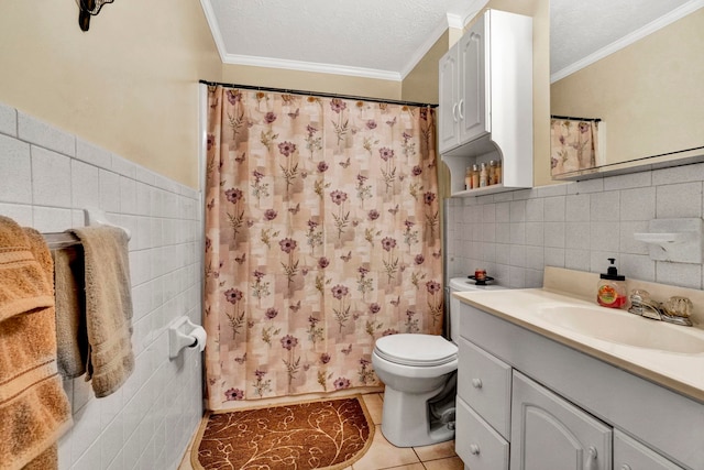 bathroom with vanity, tile patterned floors, tile walls, and ornamental molding