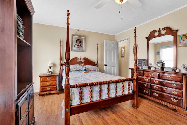 bedroom with light hardwood / wood-style flooring, ceiling fan, and ornamental molding