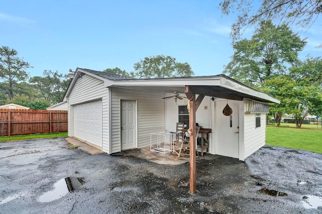 exterior space featuring ceiling fan