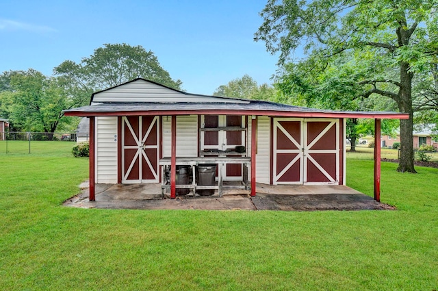 view of outbuilding with a lawn