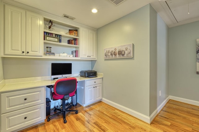 office space with light hardwood / wood-style flooring