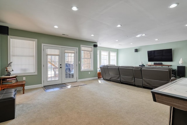 living room with french doors and light colored carpet