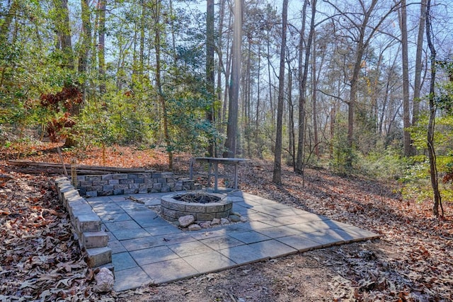 view of patio / terrace featuring a fire pit