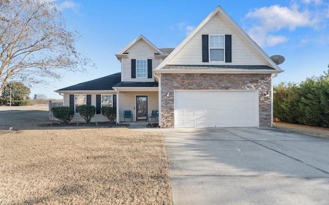 view of front of house with a garage, covered porch, and a front lawn