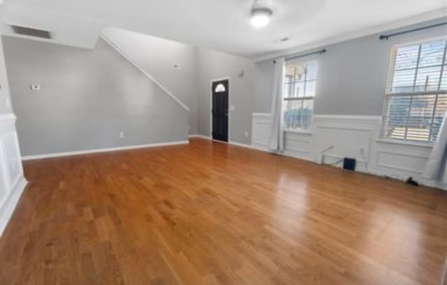 unfurnished living room with hardwood / wood-style floors