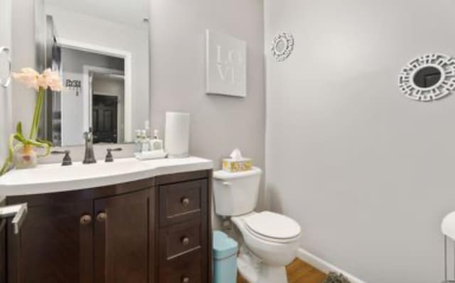 bathroom featuring vanity and toilet