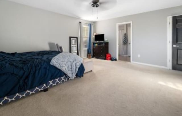 carpeted bedroom with ceiling fan