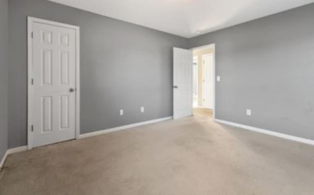 unfurnished bedroom with carpet floors