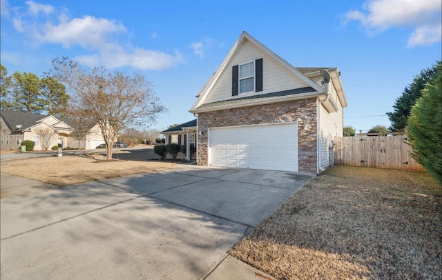 view of side of home with a garage