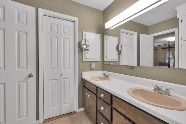 bathroom featuring tile patterned flooring and vanity