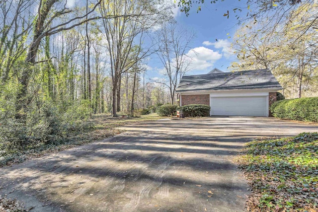 view of side of home with a garage