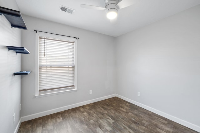 unfurnished room featuring ceiling fan and dark wood-type flooring