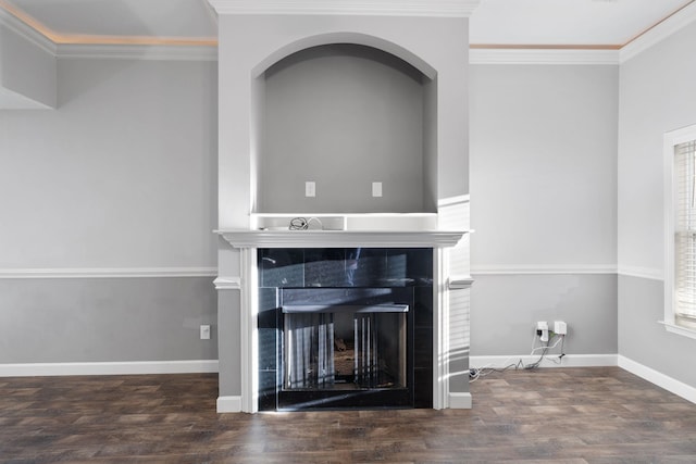 room details with wood-type flooring, ornamental molding, and a tile fireplace