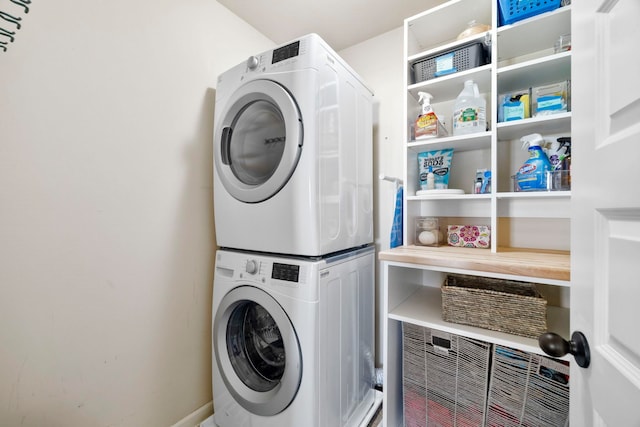 clothes washing area with stacked washer / drying machine