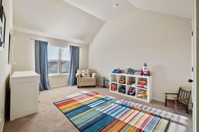 rec room featuring lofted ceiling and light carpet