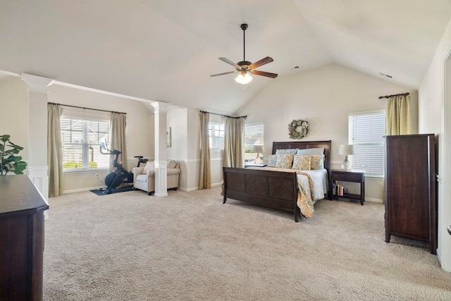 bedroom with light carpet, ornate columns, ceiling fan, and lofted ceiling