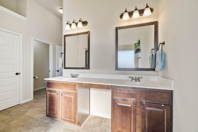 bathroom featuring vanity and lofted ceiling