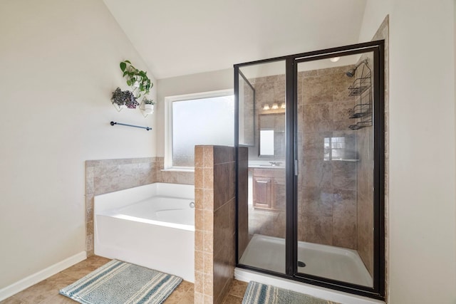 bathroom featuring tile patterned floors, lofted ceiling, and shower with separate bathtub