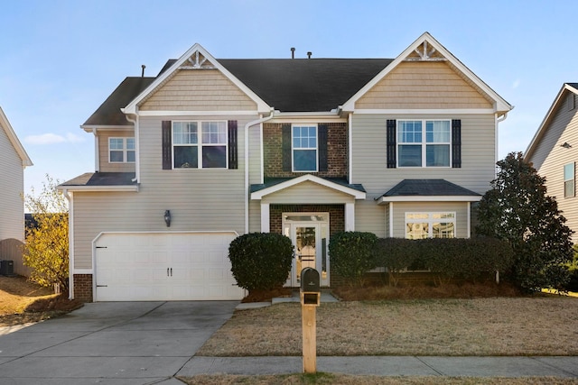 view of front of property with a garage and central air condition unit