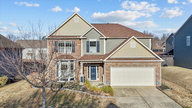 view of front of house featuring a garage and a front yard