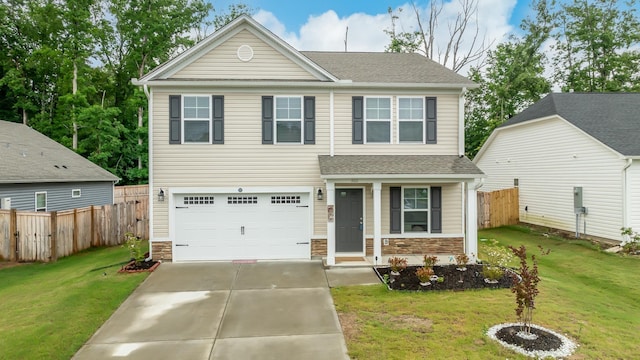 view of front of house featuring a garage and a front yard