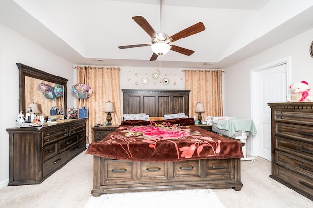 bedroom featuring lofted ceiling, light colored carpet, and ceiling fan