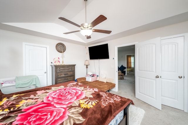 bedroom with ceiling fan, light colored carpet, and lofted ceiling