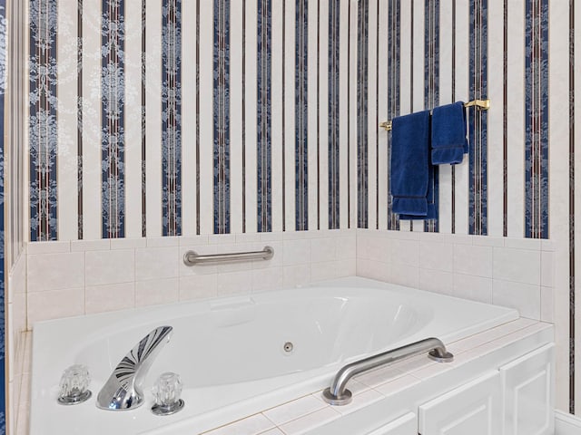 bathroom with a relaxing tiled tub