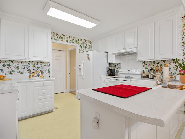 kitchen featuring white appliances, sink, ornamental molding, white cabinetry, and kitchen peninsula