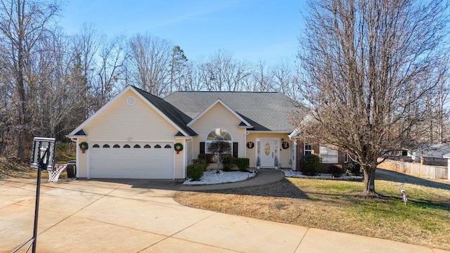 single story home featuring a garage and a front yard