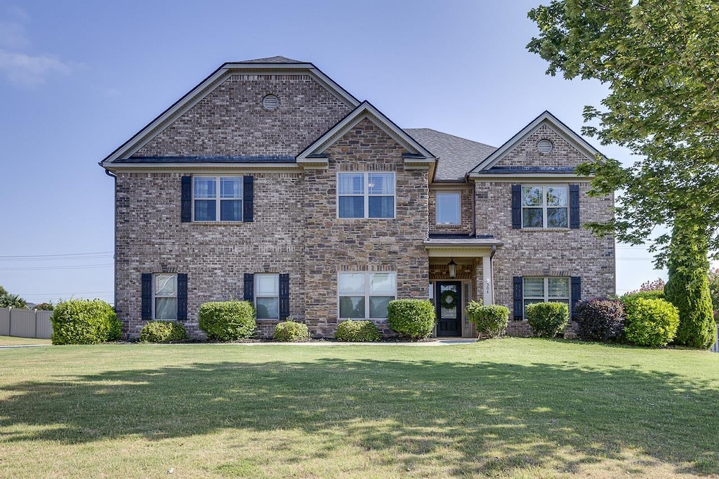 view of front of home with a front lawn