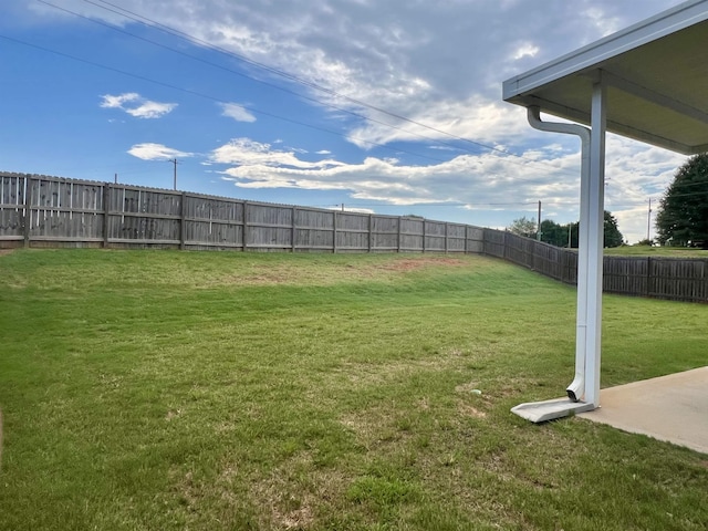 view of yard with a fenced backyard